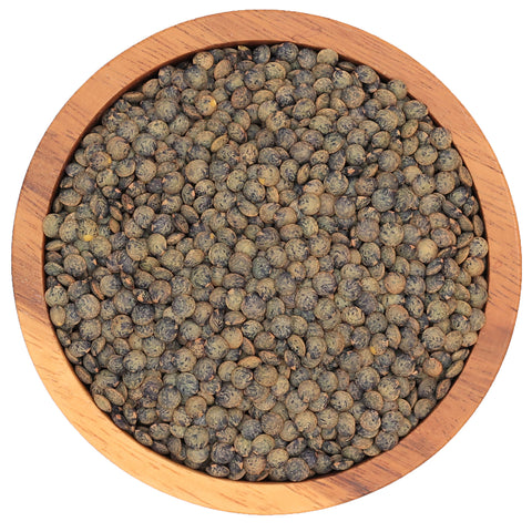 Franse berglinzen in houten kom – donkere linzen met stevige textuur