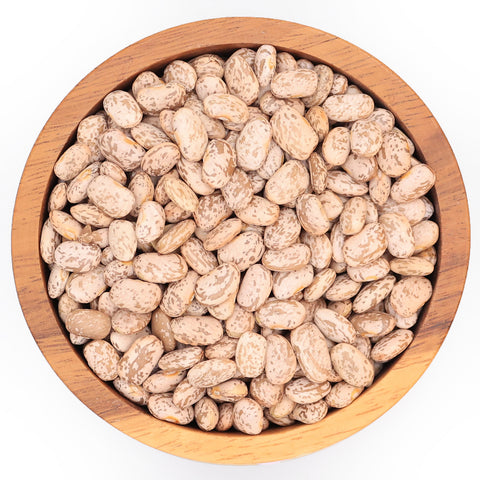 Kievitsbonen in houten kom – gespikkelde bruine bonen met glad oppervlak